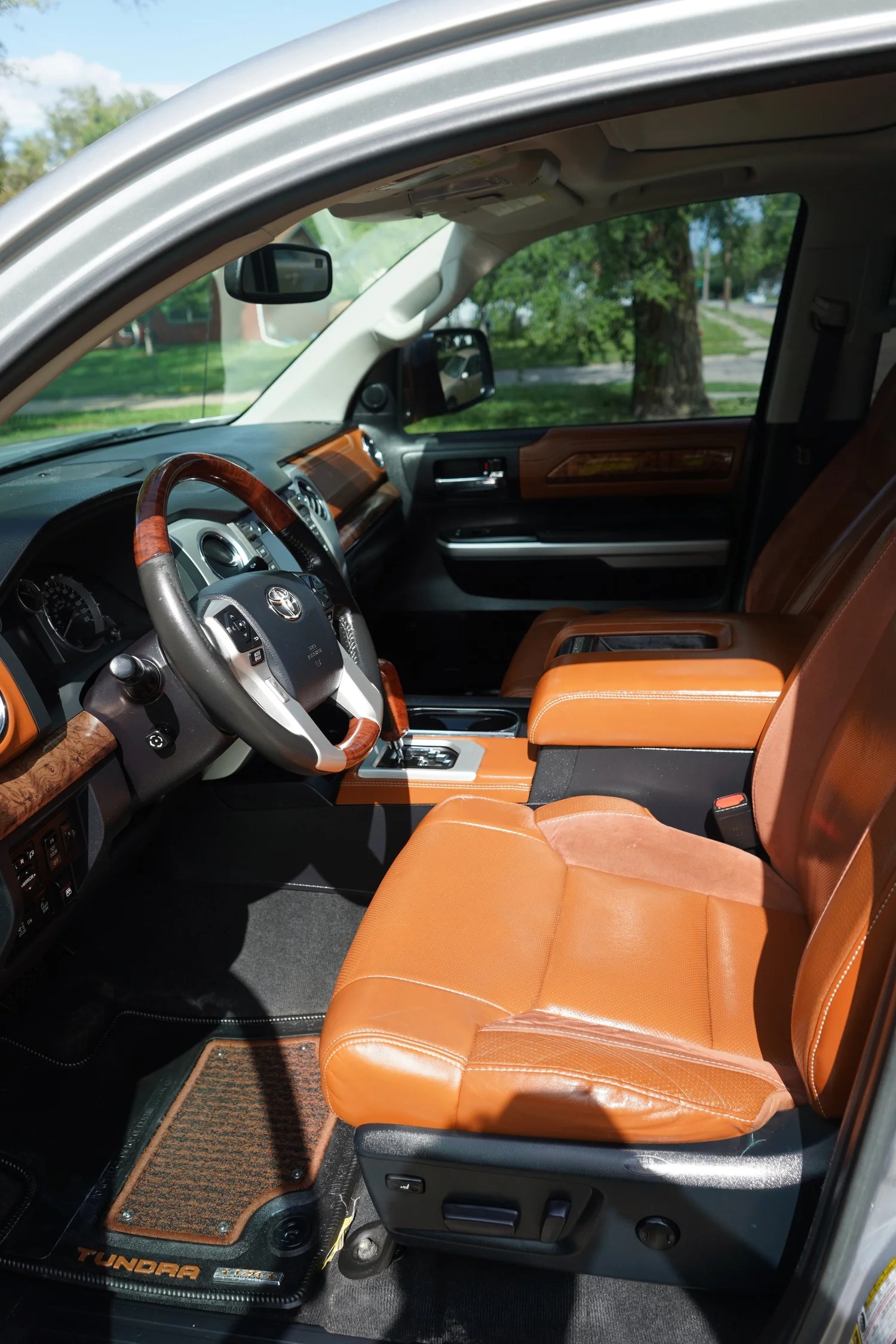Clean saddle leather seats in a Toyota Tundra after an interior detail at MC Auto Detailing, Lincoln NE
